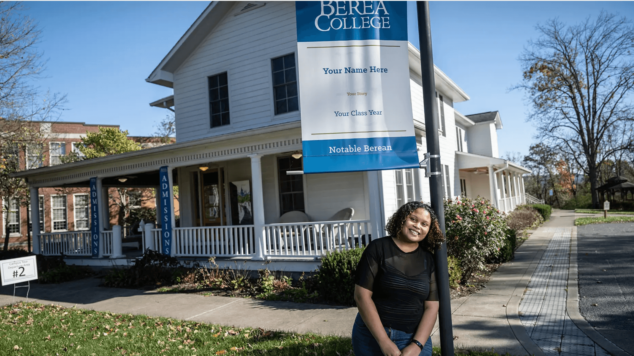 A student standing outside of Haaga House, Berea's Admissions Office.