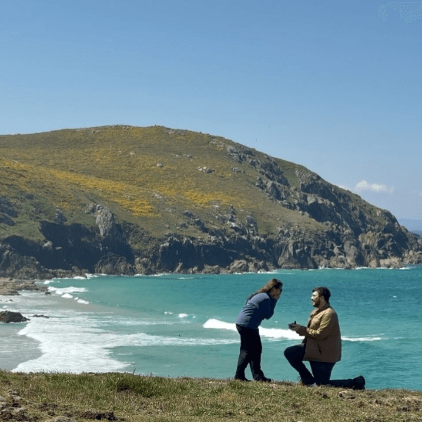 Two students get engaged by the shore at Ferrol, Spain during study abroad.